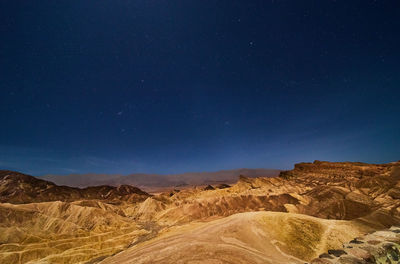 Scenic view of mountain against sky at night