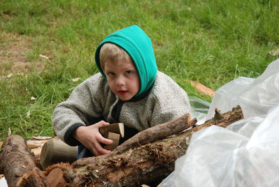 Portrait of cute boy on grass