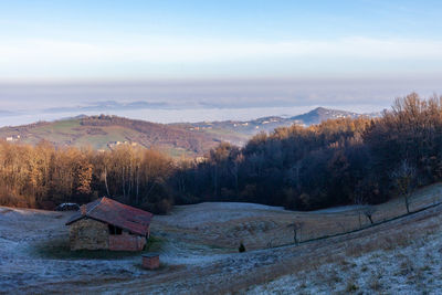 Landscape of mountains and plains covered by the fog