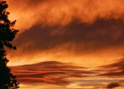 Low angle view of cloudy sky at sunset