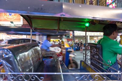 People at market stall in city