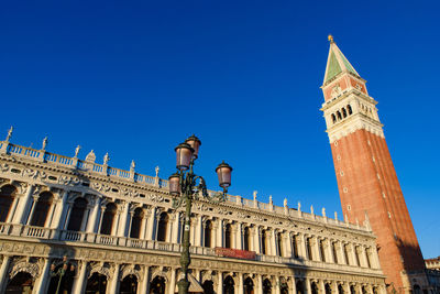 Low angle view of historical building against blue sky