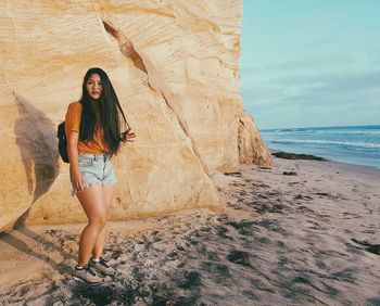 Woman standing on beach