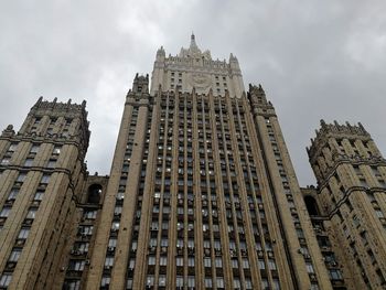 Low angle view of buildings in city against sky