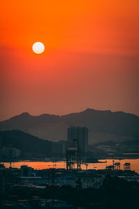 Scenic view of silhouette mountains against sky at sunset