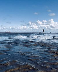 Scenic view of sea against blue sky