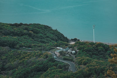 High angle view of trees by sea