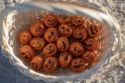 High angle view of eggs in basket on table