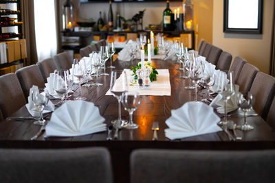 View of place settings on table at restaurant