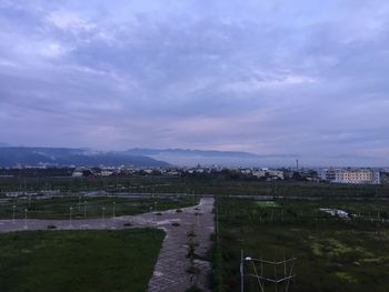 High angle view of city against cloudy sky