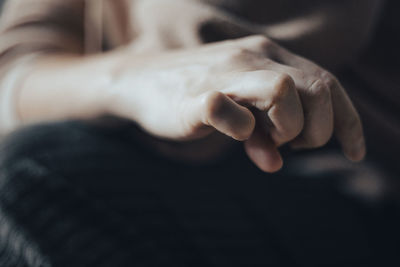 Woman's hand in pastel colors, emotionally minor plot