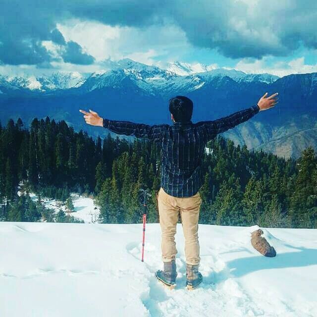 snow, winter, mountain, human arm, cold temperature, limb, leisure activity, one person, beauty in nature, scenics - nature, standing, warm clothing, full length, arms outstretched, real people, nature, vacations, lifestyles, men, mountain range, arms raised, human limb, outdoors