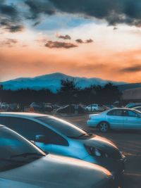 Traffic on road at sunset