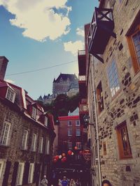 Low angle view of houses against sky