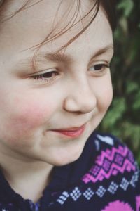 Close-up portrait of smiling girl