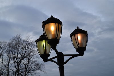 Low angle view of lamp post against sky