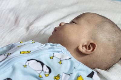 Cute baby sleeping on bed