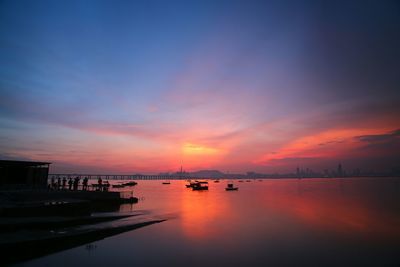 Scenic view of calm sea at sunset