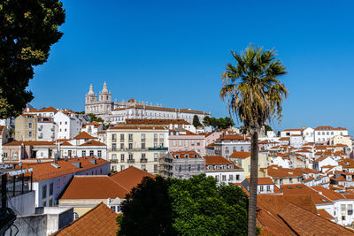 View of buildings against blue sky