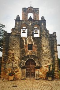 Low angle view of old building against sky