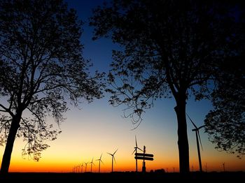 Silhouette of windmill at sunset