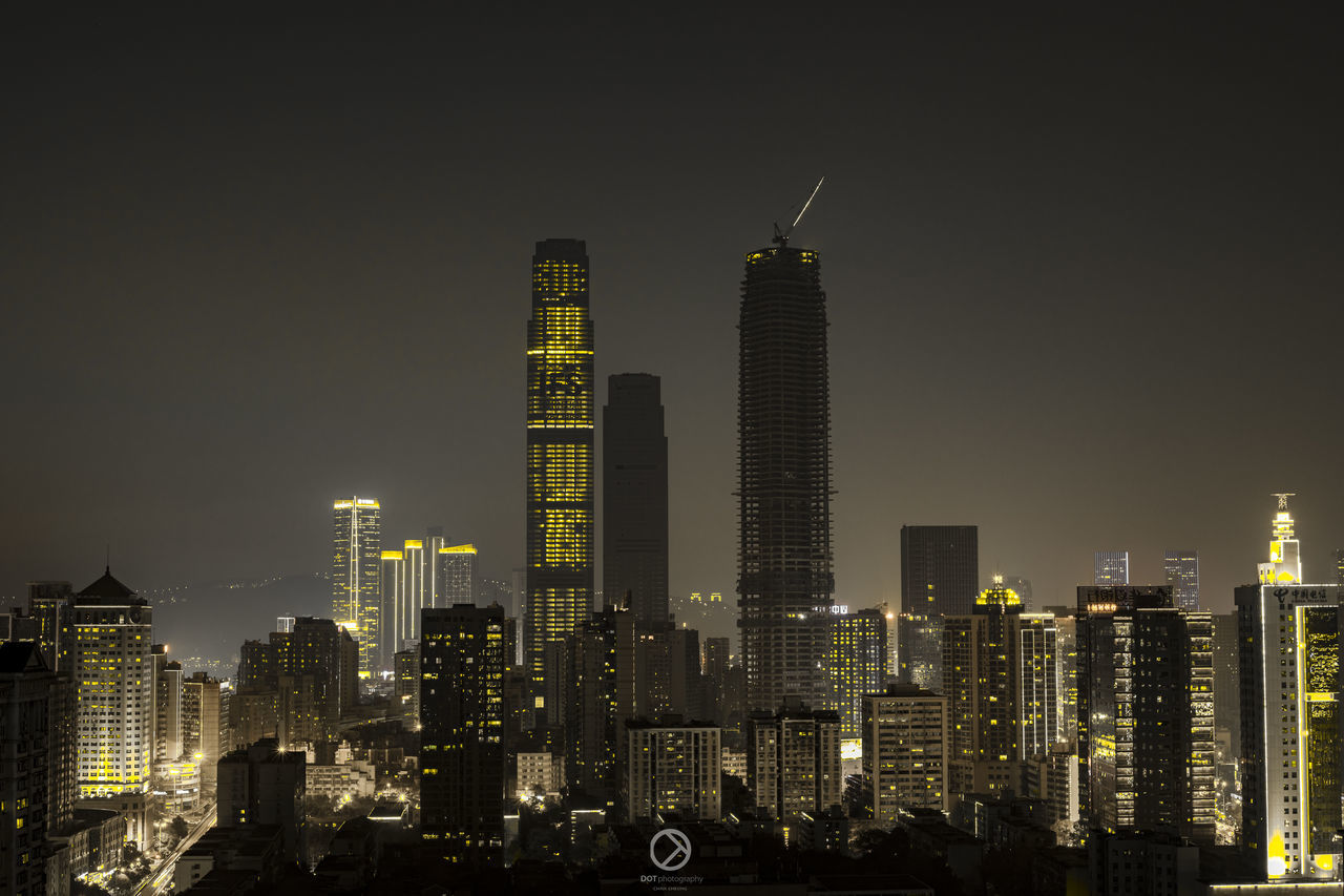 skyscraper, architecture, illuminated, tall - high, building exterior, modern, night, built structure, tower, city, cityscape, travel destinations, sky, no people, outdoors, urban skyline