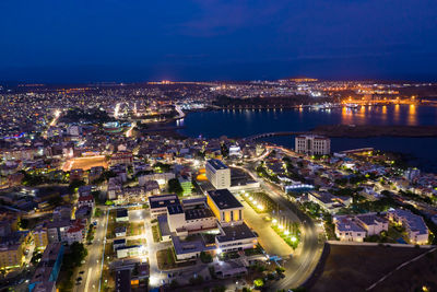 High angle view of illuminated buildings in city at night