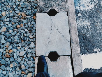 Low section of person standing on stone