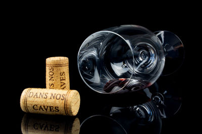 Close-up of wine glass against black background