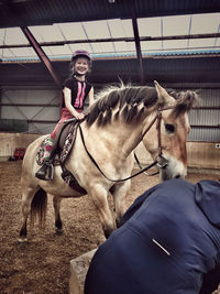 Cute girl riding horse