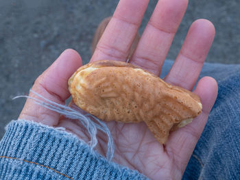 Midsection of person holding ice cream