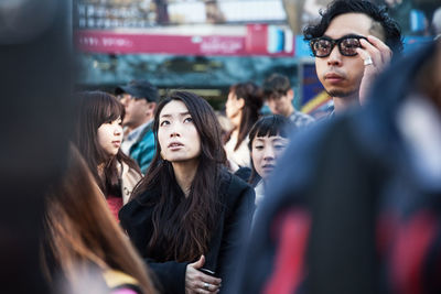 Young couple looking away