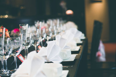 Close-up of wine glasses on dining table