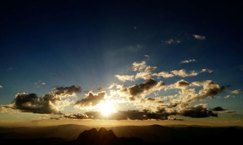 Scenic view of landscape against sky at sunset