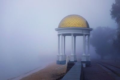 Lifeguard hut in lake against sky