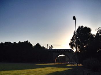 View of trees against sky at sunset