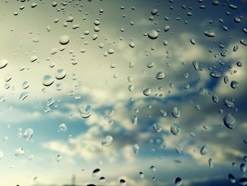 Full frame shot of wet glass window