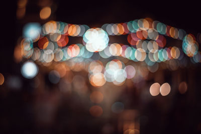 Defocused image of illuminated lights at night