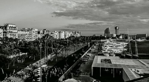 View of cityscape against cloudy sky