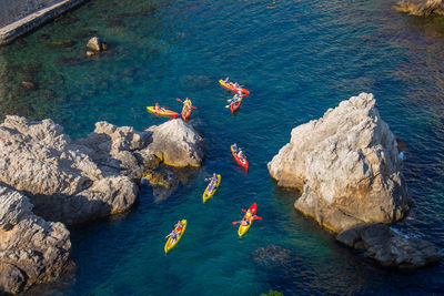 High angle view of people swimming in sea