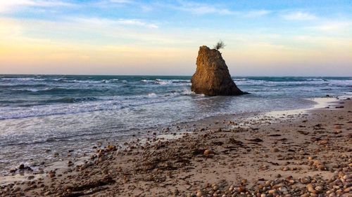 Scenic view of sea against sky at sunset