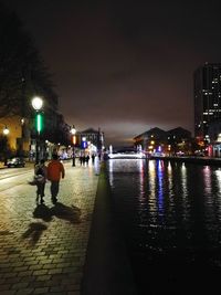 Panoramic view of illuminated beach against sky at night