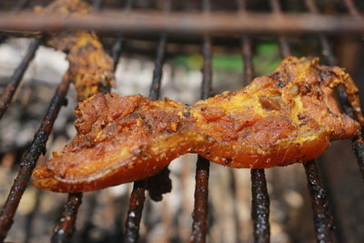 Close-up of meat on barbecue grill