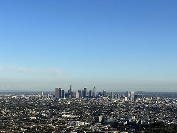 Cityscape against clear sky