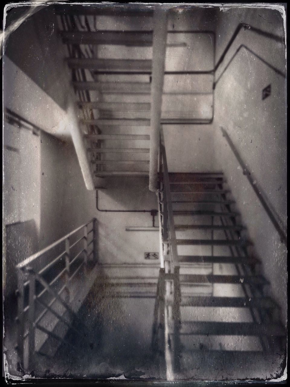 transfer print, auto post production filter, steps, indoors, steps and staircases, staircase, architecture, railing, built structure, metal, high angle view, wall - building feature, stairs, building, low angle view, wall, no people, door, old, abandoned