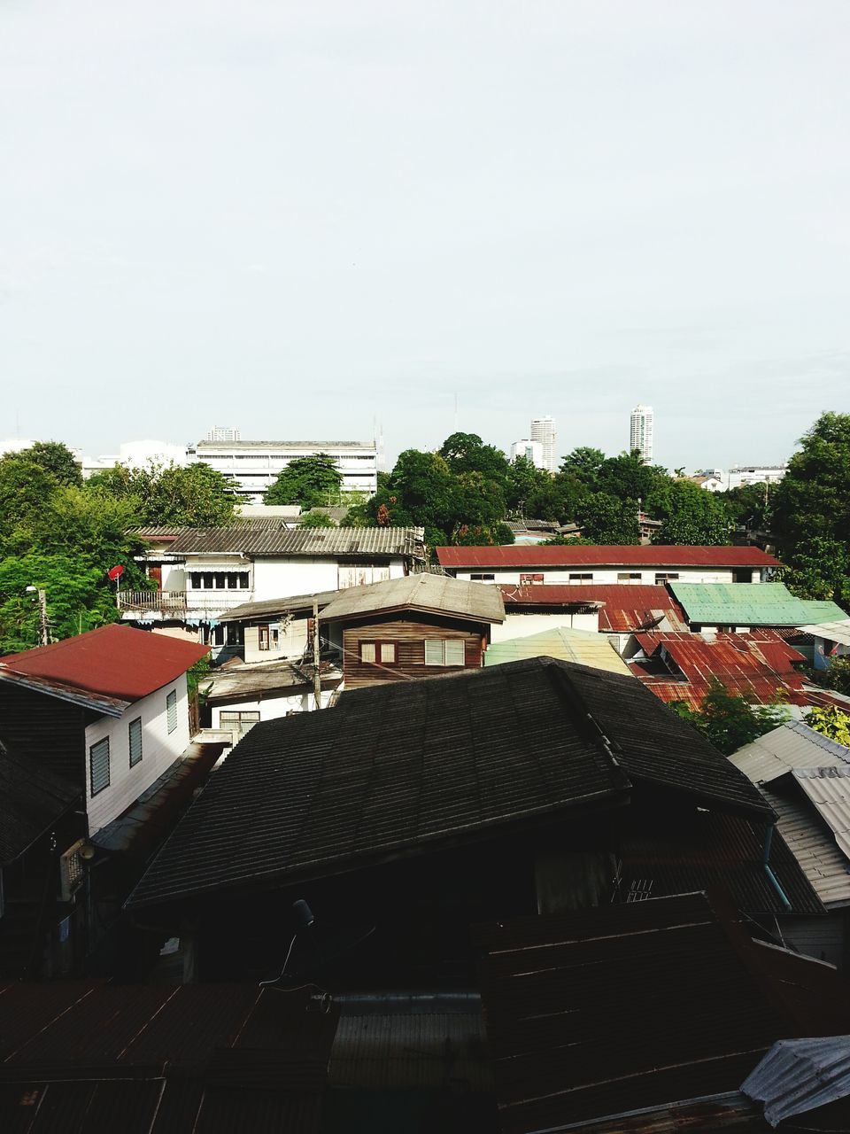 architecture, built structure, building exterior, roof, residential building, house, high angle view, residential structure, clear sky, city, rooftop, day, sky, town, no people, residential district