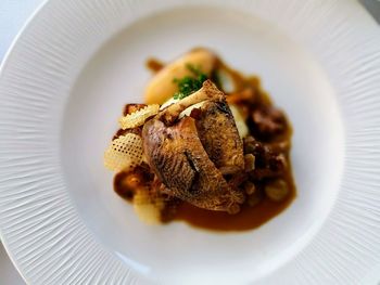 High angle view of meat in plate on table
