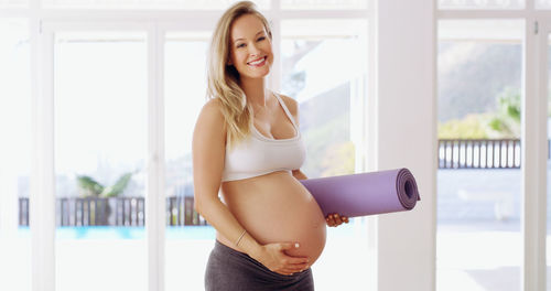 Young woman exercising in gym