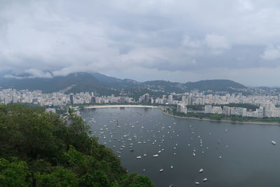 High angle view of river and city against sky