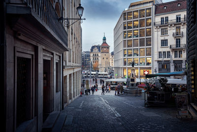 People walking on street in city